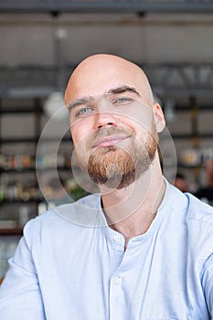 White european bald man in the workspace