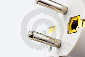 White European electric power cable with plug on light background with copy space close up.