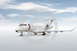 White executive airplane with an opened gangway door isolated on bright background with sky
