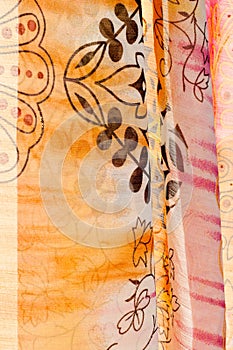 White fabric texture. pink, yellow, and brown pattern