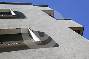 White facade of a residential building low angle