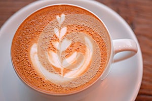 White faience cup with coffee drink cappuccino photo