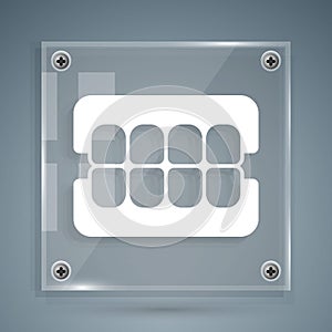 White False jaw icon isolated on grey background. Dental jaw or dentures, false teeth with incisors. Square glass panels