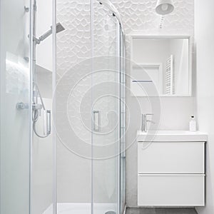 White and fancy bathroom with shower