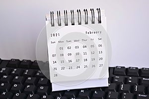 White February 2021 calendar on a keyboard with white backgrounds. New Year Concept photo