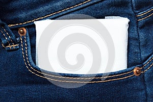 White feminine hygiene pad in a jeans pocket