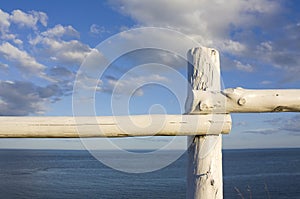 White fence overlooking atlantic ocean