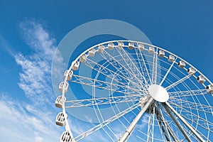 White ferris wheel against blue background