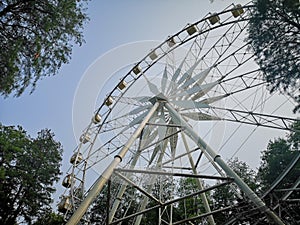 White ferris wheel in the park in winter