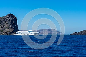 White ferry boat in santorini caldera