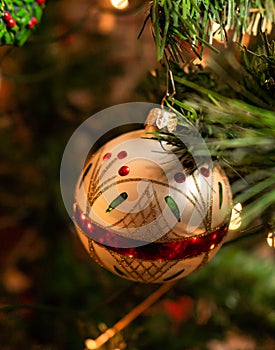 White festive Christmas ornament on tree