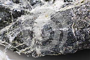 White fibers of asbestos mineral in stone