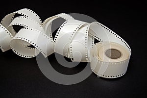 White film reel on a black background