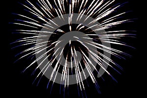White fireworks with blue sparks on an isolated black background for design decoration of the holidays, the new year, as well as i