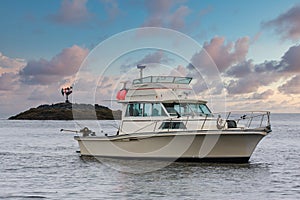 White Fishing Boat in Alaskan Waterway at Dusk