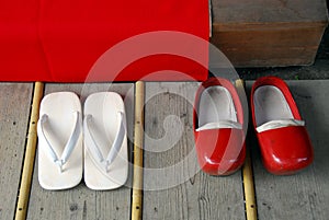 White flip-flops and red clogs