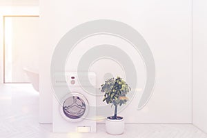White floor bathroom washing machine closeup toned