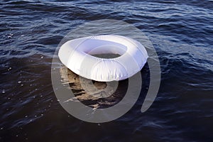 white flotation ring on blue sea,