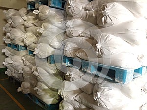 White flour bag arranged in a raw material warehouse