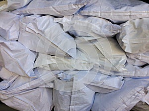 White flour bag arranged in a raw material warehouse