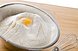 White flour and egg in bowl