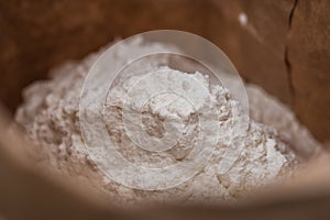 White flour in a paper bag