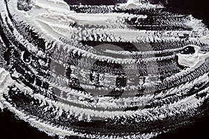 Flour Patterns Created on a Dark Surface During Baking Activities in a Kitchen