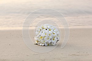 White flower wedding bouquet on tropical beach