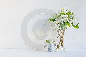 White flowers in a vase on a light background