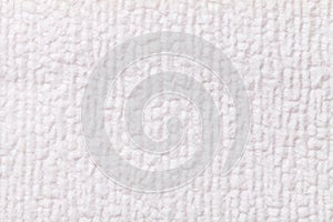 White fluffy background of soft, fleecy cloth. Texture of textile closeup.