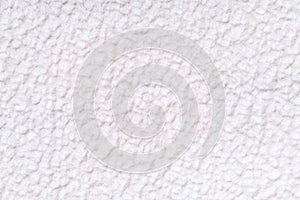 White fluffy background of soft, fleecy cloth. Texture of textile closeup.