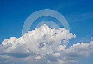 white fluffy cloud in deep blue sky in summer morning