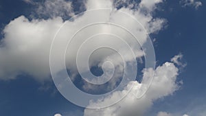 White fluffy clouds and blue sky