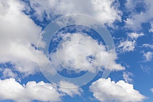 White, fluffy clouds in blue sky