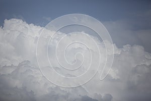 White, fluffy clouds in blue sky.