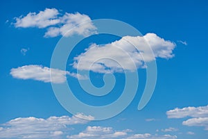 White, Fluffy Clouds In Blue Sky. Clear blue sky with white clouds background