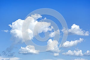 White fluffy clouds and blue sky. Nature weather background