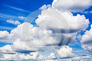 White fluffy clouds on clear sunny blue sky background closeup, cumulus cloud texture, cloudy skies, cloudiness, cloudscape heaven