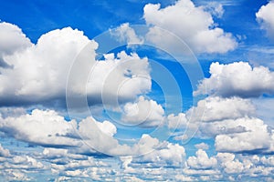 White fluffy clouds on clear sunny blue sky background closeup, cumulus cloud texture, cloudy skies, cloudiness, cloudscape heaven