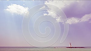 White fluffy clouds footage, beautiful sunny day abstract color sky. clouds traveling fast in blue sky with a ripple of seawater