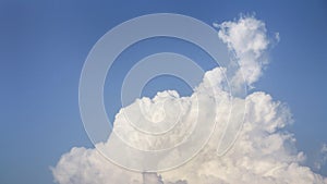 White fluffy clouds open for fantasy idea shape against bright blue sky for background with copy space, graphic resource, cloud