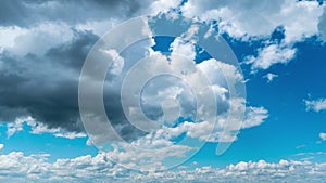 White Fluffy Clouds Slowly Float Through the Blue Daytime Sky Timelapse