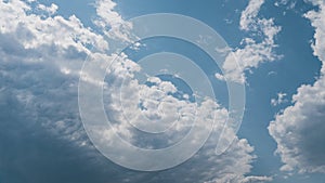 White Fluffy Clouds Slowly Float Through the Blue Daytime Sky Timelapse