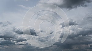 White Fluffy Clouds Slowly Float Through the Blue Daytime Sky Timelapse