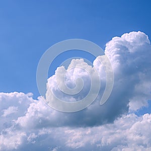 White fluffy clouds in the vast blue sky. Abstract nature background. For instagram format. Square. Space for text.