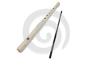 White flute recorder on a white isolated background, close-up