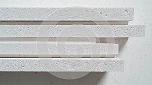 White foam blocks arranged in a horizontal stack.