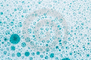 white foam bubbles.Cleanliness and hygiene background. Foam Water Soap Suds.Texture Foam Close-up. blue soap bubbles