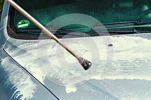 White foam on cars bonnet applied by steam radiator