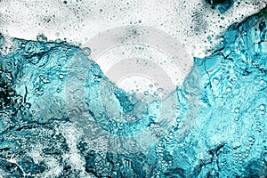 White foam clear blue water background closeup, sea or ocean foam wave border, froth bubbles texture, lather backdrop, soap suds